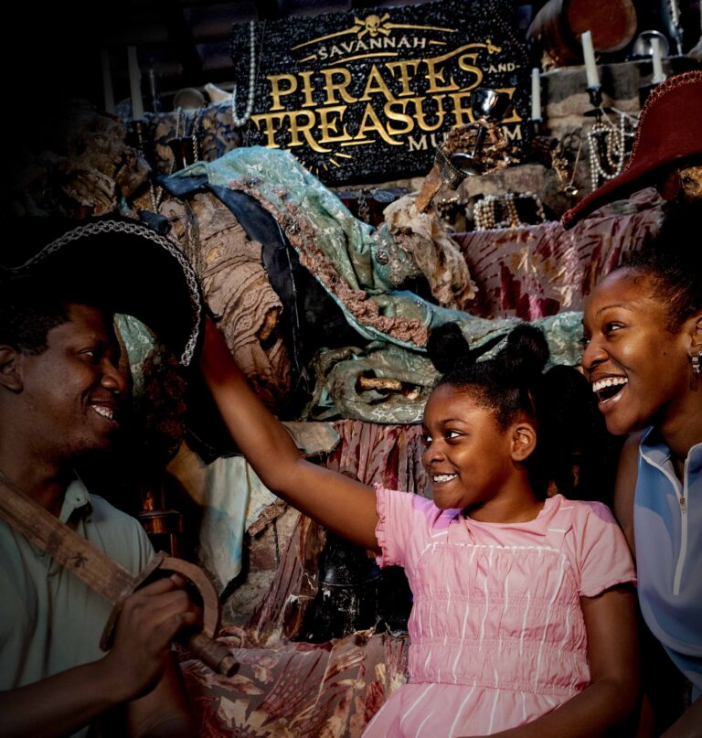 trying on pirate costumes at the pirate and treasure museum